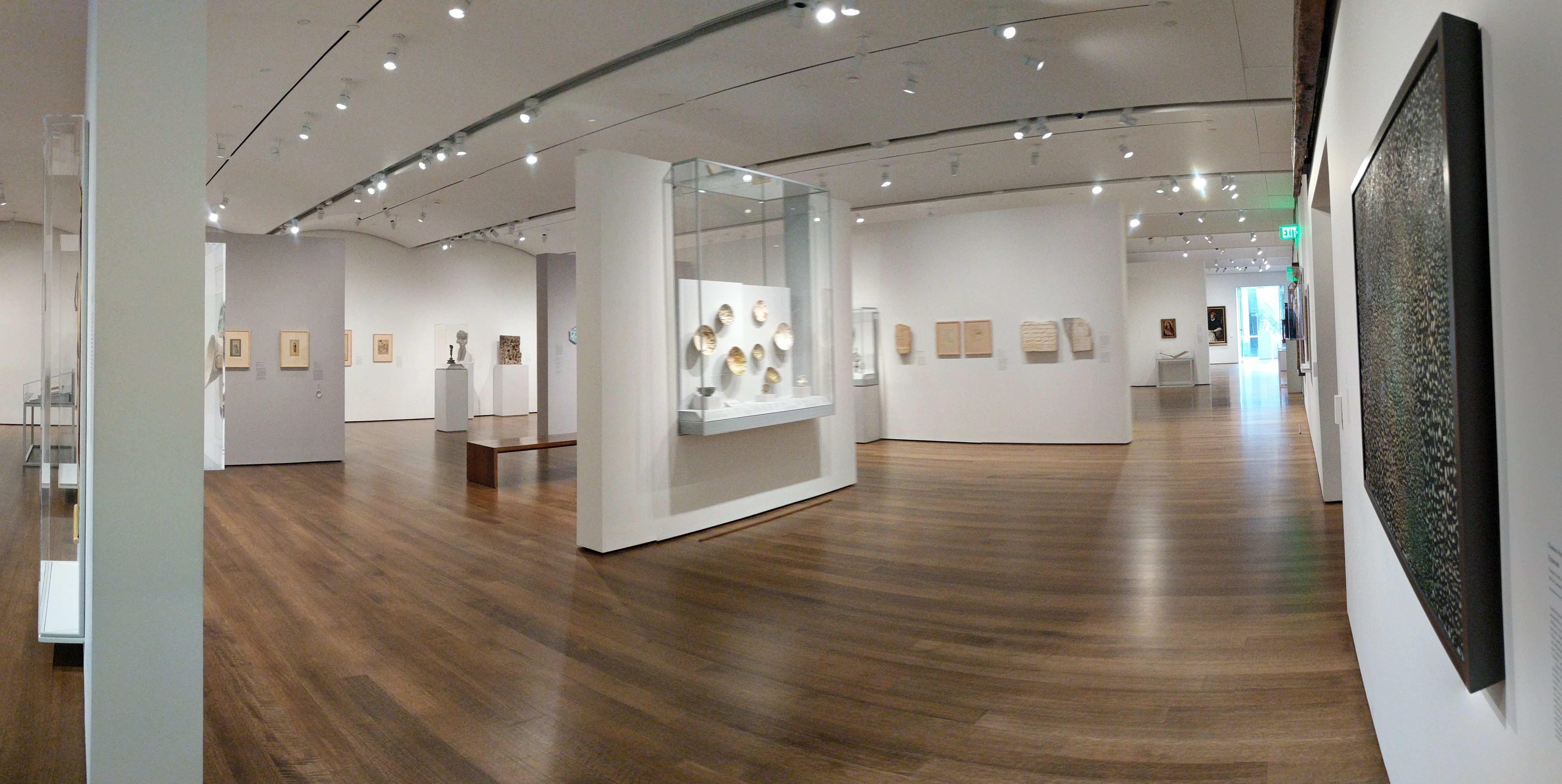 An image of an exhibit in the HAM. It is stark white, and spacious.